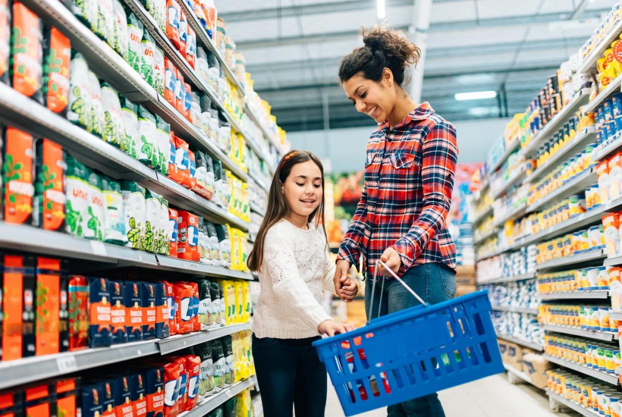 <span class="caption">There are dozens of options for children's drinks in most supermarkets. Choosing the healthy options is difficult.</span> <span class="attribution"><a class="link " href="https://www.gettyimages.com/detail/photo/mother-and-daughter-shopping-in-supermarket-royalty-free-image/1210359370?adppopup=true" rel="nofollow noopener" target="_blank" data-ylk="slk:ferrantraite/E+ via Getty Images;elm:context_link;itc:0;sec:content-canvas"> ferrantraite/E+ via Getty Images</a></span>
