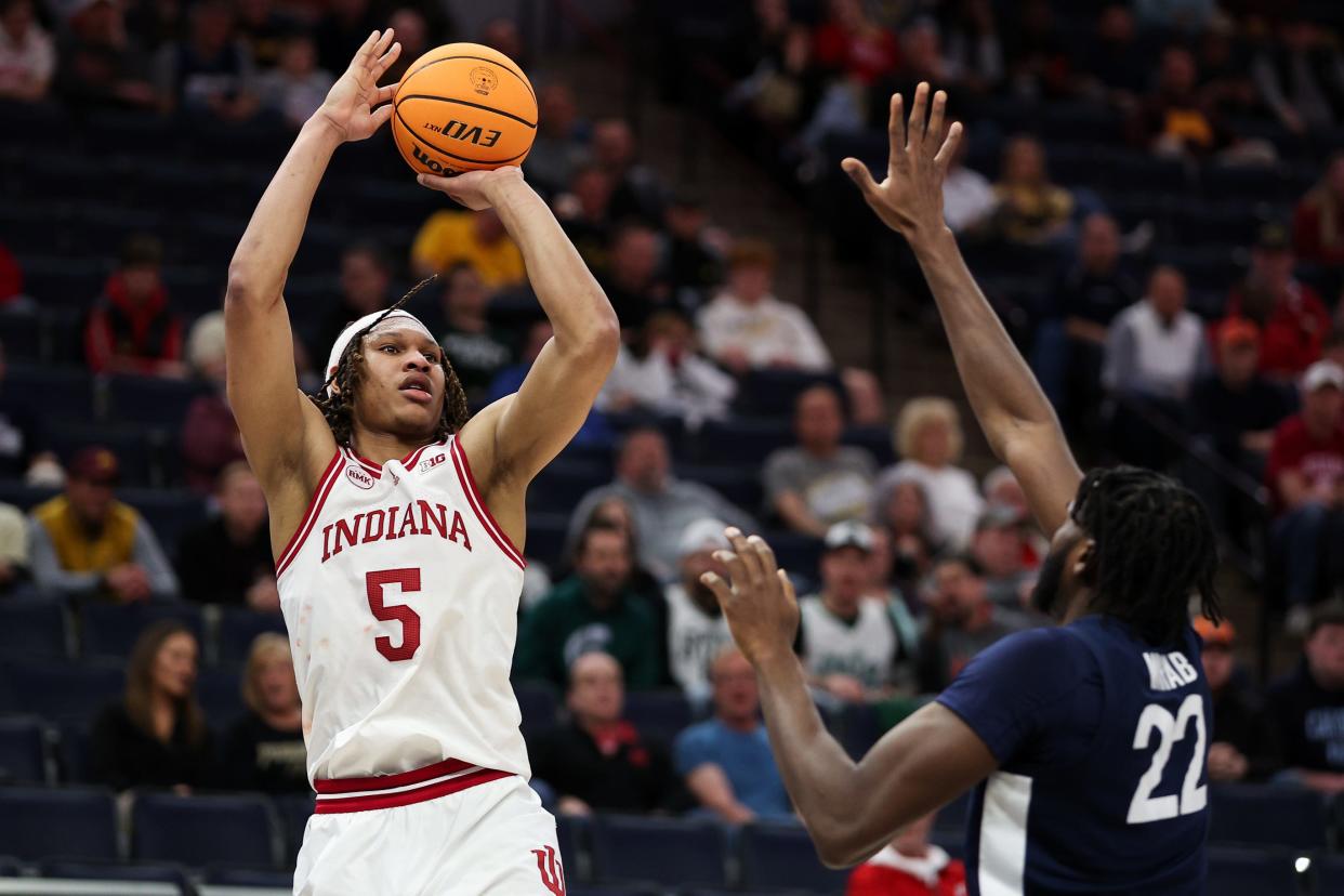 Indiana Hoosiers forward Malik Reneau (5) shoots as Penn State Nittany Lions forward Qudus Wahab (22) defends during the first half at Target Center.