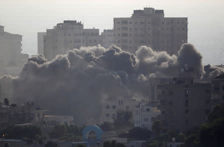 Smoke rises following an Israeli strike on a building in Gaza City July 14, 2018. REUTERS/Ahmed Zakot