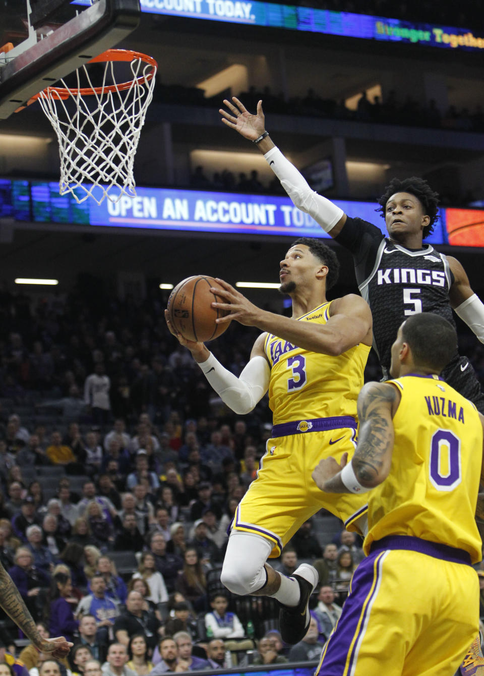 Los Angeles Lakers guard Josh Hart (3) drives to the basket as Sacramento Kings guard De'Aaron Fox (5) defends during the first half of an NBA basketball game in Sacramento, Calif., Thursday, Dec. 27, 2018. (AP Photo/Steve Yeater)