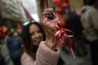 <p>A trade union demonstrator wraps her hand with a red ribbon during a May Day rally in Pamplona, northern Spain, May 1, 2018. (Photo: Alvaro Barrientos/AP) </p>