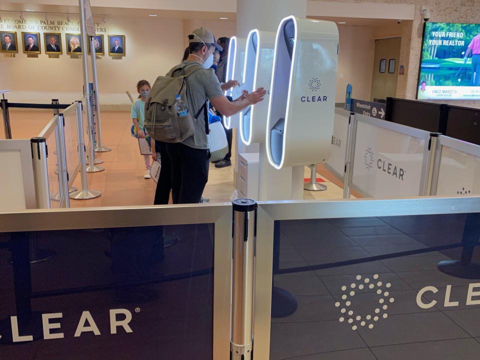 Passengers using CLEAR kiosk that allows quick and secure Identity confirmation, West Palm Beach Airport, Florida.