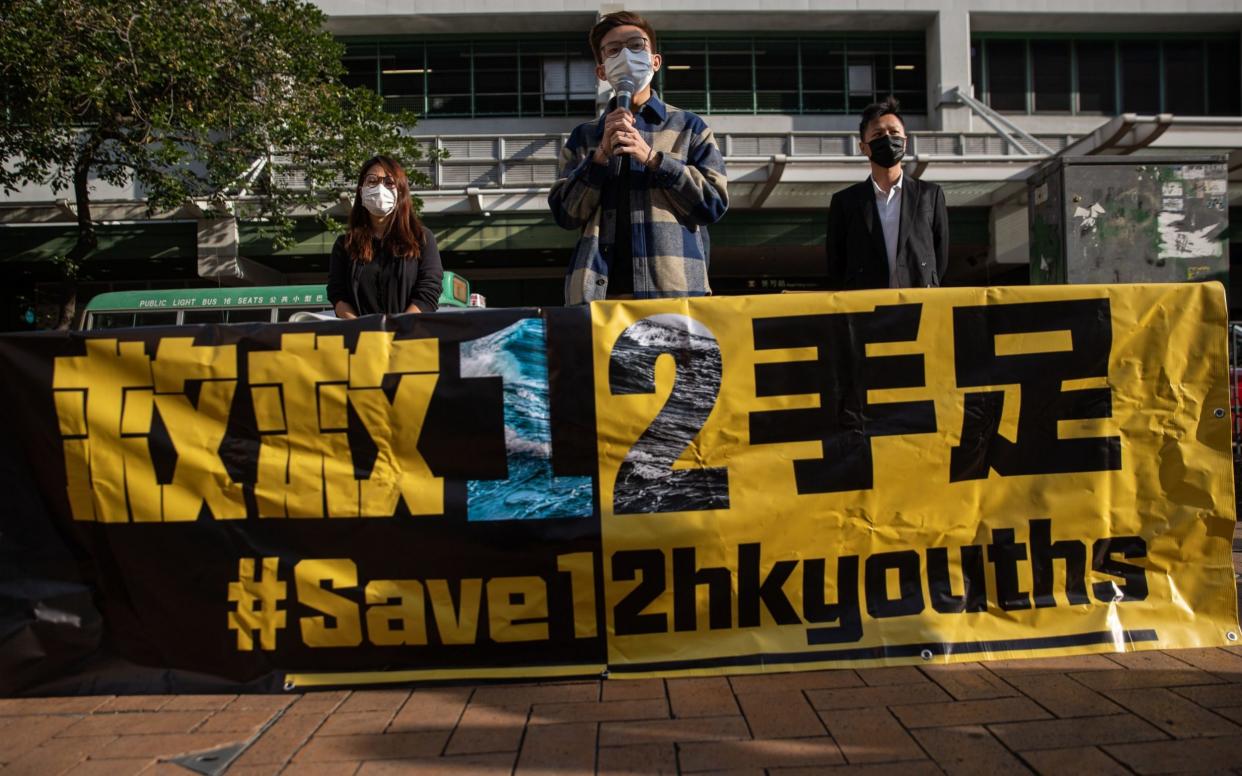 Pro-democracy district councillors speak in support of the 12 Hongkongers, which were detained in Shenzhen - JEROME FAVRE/EPA-EFE/Shutterstock /Shutterstock