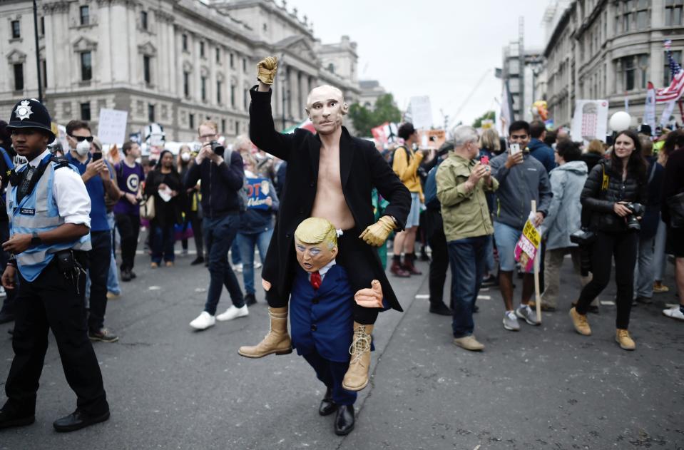 A protester dressed as Russian President Vladimir Putin riding on the shoulders of U.S. President Donald Trump during a demonstration on Whitehall on the second day of U.S. President Donald Trump's State Visit on June 4, 2019 in London, England.