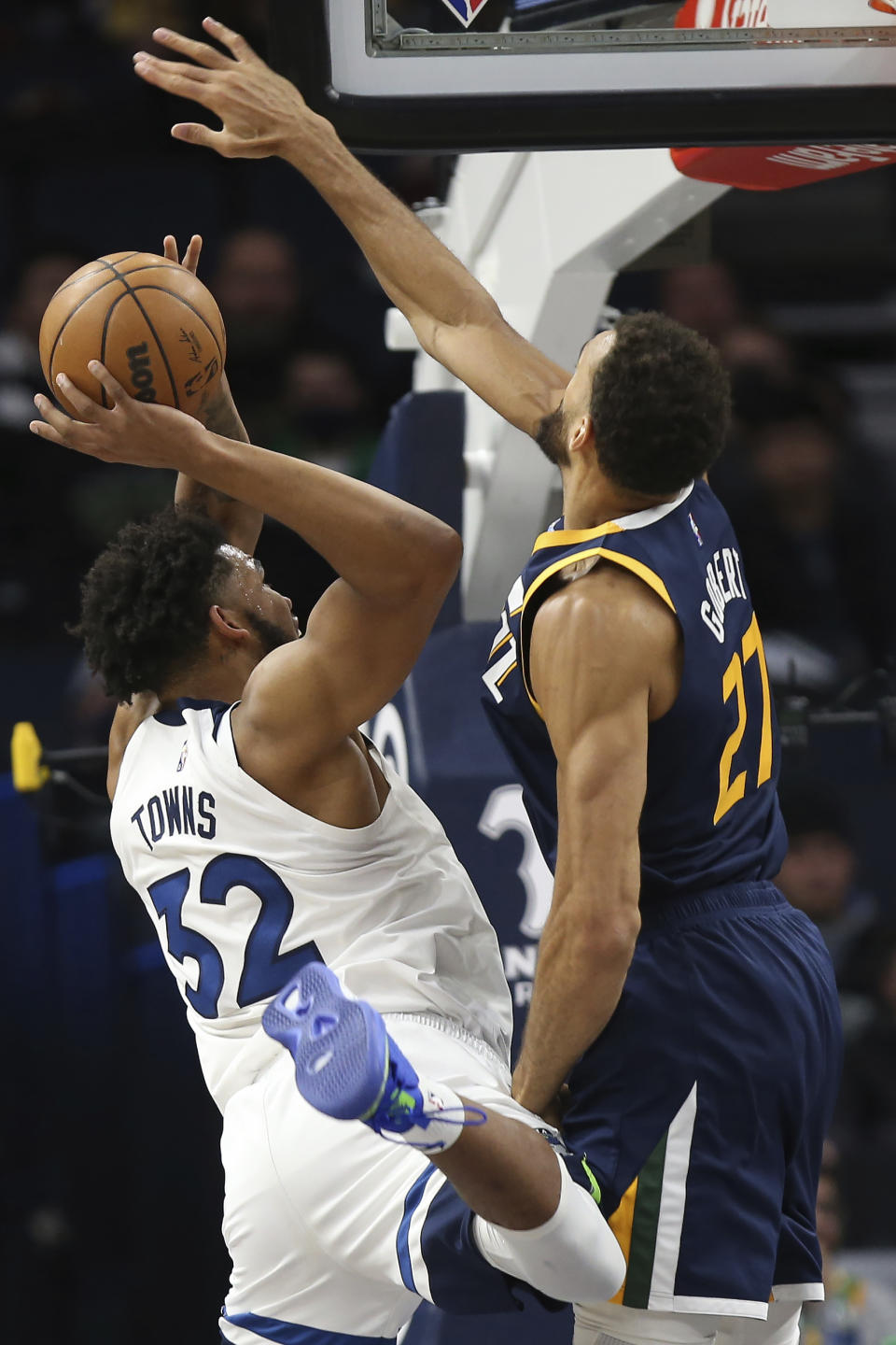 Minnesota Timberwolves center Karl-Anthony Towns (32) tries to get up to the basket against Utah Jazz center Rudy Gobert (27) during the first half of an NBA basketball game Wednesday Dec. 8, 2021, in Minneapolis. Utah won 136-104. (AP Photo/Stacy Bengs)