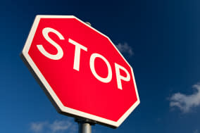 stop sign against deep blue sky....