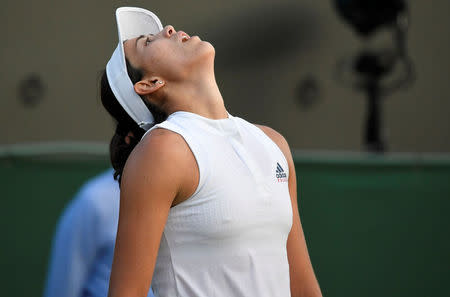 Tennis - Wimbledon - All England Lawn Tennis and Croquet Club, London, Britain - July 5, 2018. Spain's Garbine Muguruza reacts during her second round match against Belgium's Alison Van Uytvanck. REUTERS/Toby Melville