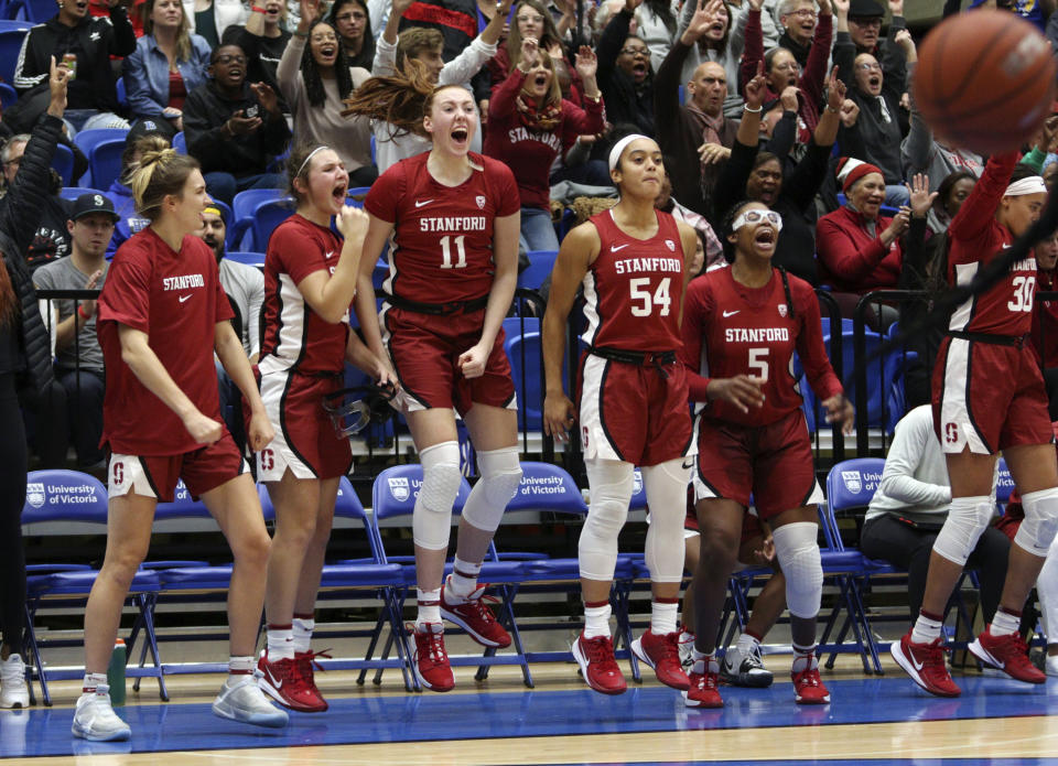 Stanford players celebrate a basket from the bench against Mississippi State during the third quarter of an NCAA college basketball game in Victoria, British Columbia, Saturday, Nov. 30, 2019. (Chad Hipolito/The Canadian Press via AP)