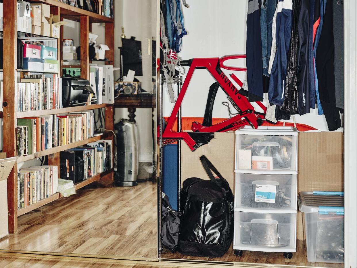 a broken bike sittting in a closet