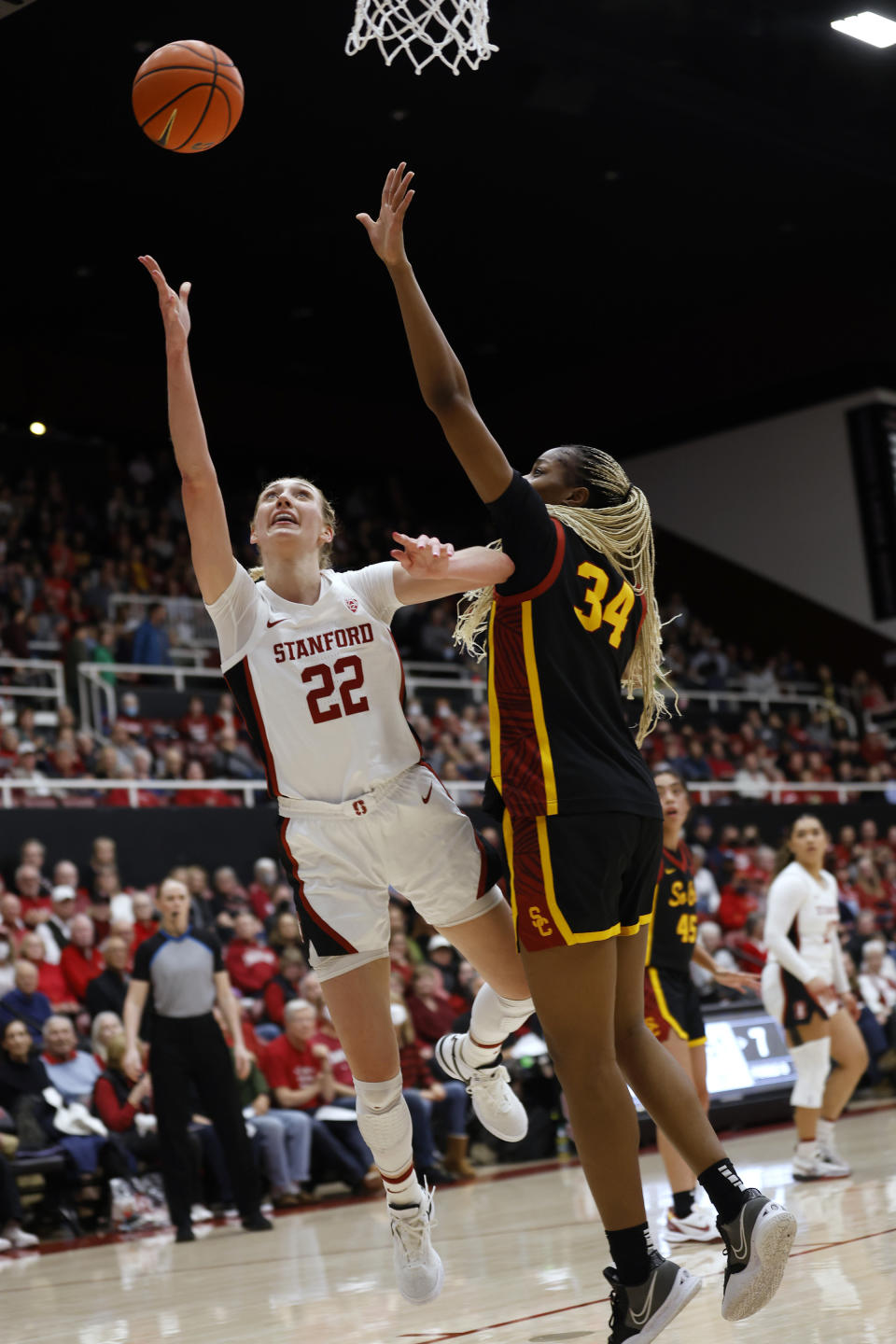 Stanford forward Cameron Brink (22) goes to the basket against the Southern California center Clarice Akunwafo (34) in the first half of an NCAA college basketball game Friday, Feb. 2, 2024, in Stanford, Calif. (AP Photo/Josie Lepe)