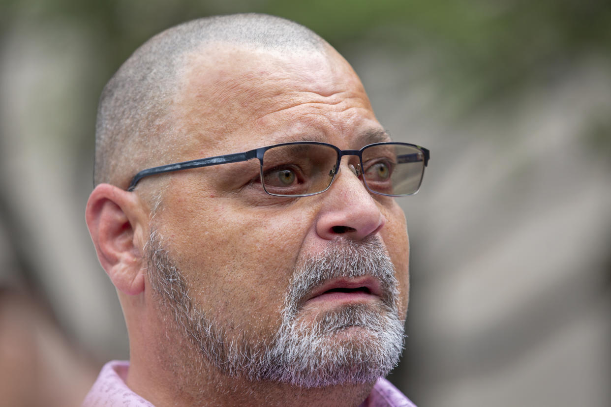 Dean Reckard, brother of Margie Reckard, who died in the Walmart mass shooting, gets emotional while talking to the media about his sister at the end of the second day of the sentencing hearing for perpetrator Patrick Crusius at the federal court in El Paso, Texas, Thursday, July 6, 2023. Nearly four years after a white gunman killed 23 people at a Walmart in El Paso in a racist attack that targeted Hispanic shoppers, relatives of the victims are packing a courtroom near the U.S.-Mexico border this week to see Crusius punished for one of the nation's worst mass shootings. (AP Photo/Andrés Leighton)