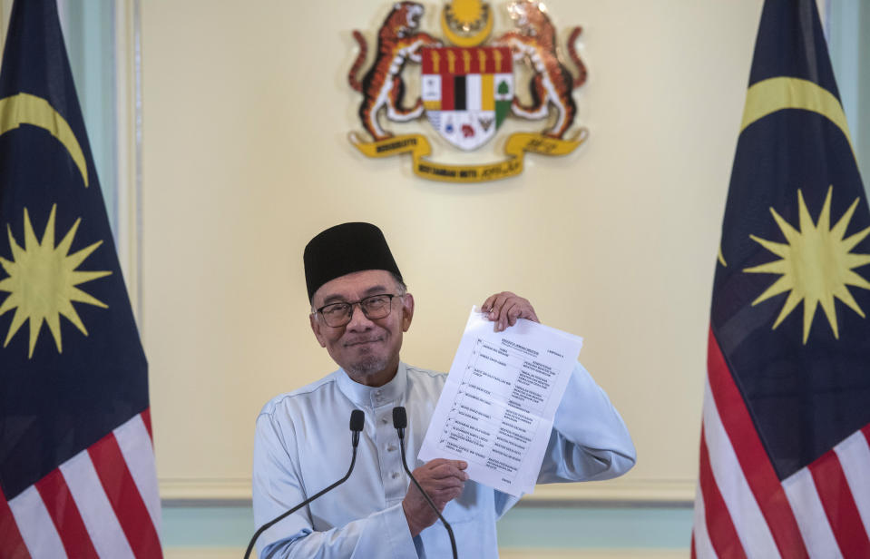 Malaysia's Prime Minister Anwar Ibrahim speaks at a press conference at the prime minister's office in Putrajaya, Malaysia, Friday, Dec. 2, 2022. New Malaysian Prime Minister Anwar Ibrahim said Friday he will also serve as finance minister as he unveiled a leaner Cabinet with many new faces in his unity government. (AP Photo/Vivian Loo)