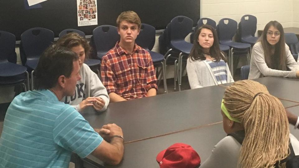 Len Mattiace (left) talks with students at Norcross High School in Atlanta last year ab out bullying and its affects.