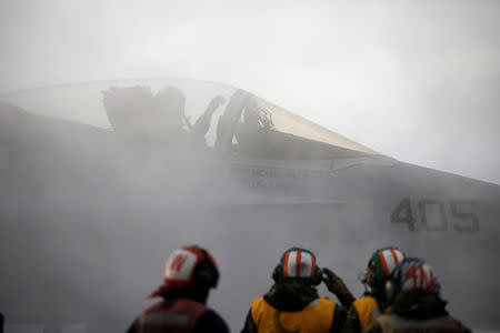 A U.S. F18 fighter jet prepares for take off from the deck of U.S. aircraft carrier USS Carl Vinson during an annual joint military exercise called "Foal Eagle" between South Korea and U.S., in the East Sea, South Korea, March 14, 2017. REUTERS/Kim Hong-Ji