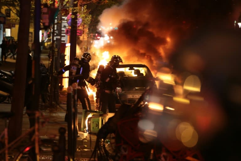 Cars were set alight and clashes erupted as at least 170,000 workers and students took to the streets across France