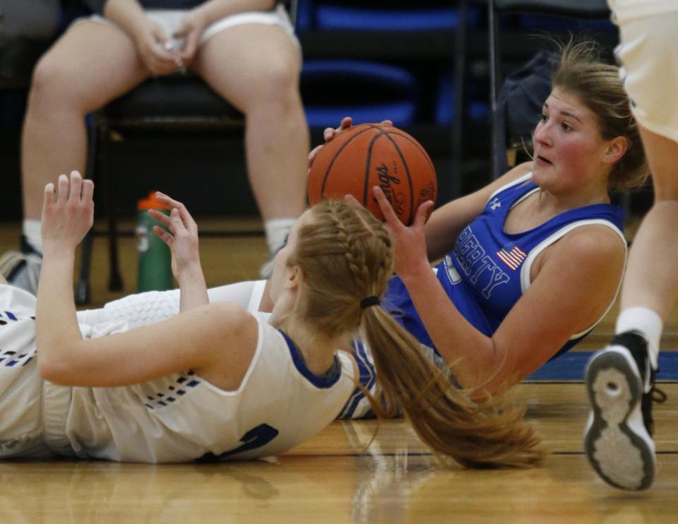 Liberty's Gigi Bower works for a loose ball against Hilliard Bradley last season. The sophomore is one of the Patriots' top players after averaging 9.0 points, 2.8 rebounds and 2.0 steals while shooting 39.5% from 3-point range last winter.