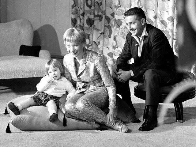 <p>CBS Photo Archive/Getty</p> Shirley MacLaine and Steve Parker with their daughter Sachi Parker on an episode of the CBS celebrity interview program 'Person to Person' on March 6, 1959.