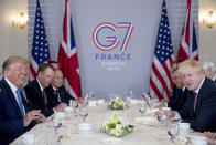 President Donald Trump and Britain's Prime Minister Boris Johnson, right, attend a working breakfast at the Hotel du Palais on the sidelines of the G-7 summit in Biarritz, France, Sunday, Aug. 25, 2019. (AP Photo/Andrew Harnik)