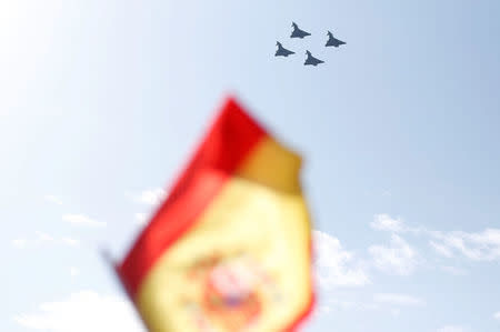 Four Eurofighter jets take part in a flypast as part of celebrations to mark Spain's National Day in Madrid, October 12, 2017. REUTERS/Andrew Winning