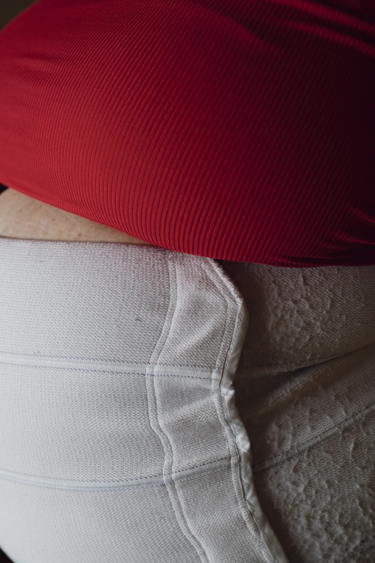 A binder holds up Sandy Aken’s stomach closer to her body at her mother’s home in Anaheim, Calif., on Sunday, Oct. 22, 2023. (Gabriella Angotti-Jones/The New York Times)