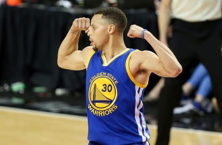 May 9, 2016; Portland, OR, USA; Golden State Warriors guard Stephen Curry (30) flexes his muscles after making a basket in overtime against the Portland Trail Blazers in game four of the second round of the NBA Playoffs at Moda Center at the Rose Quarter. Mandatory Credit: Jaime Valdez-USA TODAY Sports