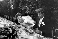<p>Lisa Larsen took this photo of Jacqueline Kennedy and John F. Kennedy Jr. at their wedding in Newport, Rhode Island, in September 1953. </p>