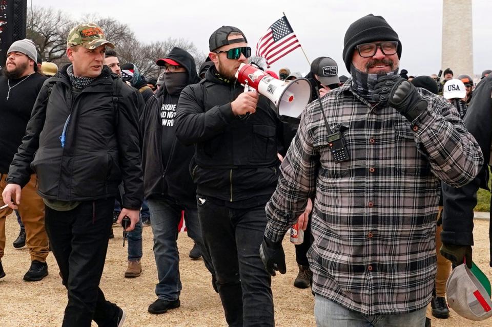 From left, Proud Boys defendants Zachary Rehl, Ethan Nordean and Joe Biggs are pictured marching towards the US Capitol on 6 January, 2021. (AP)