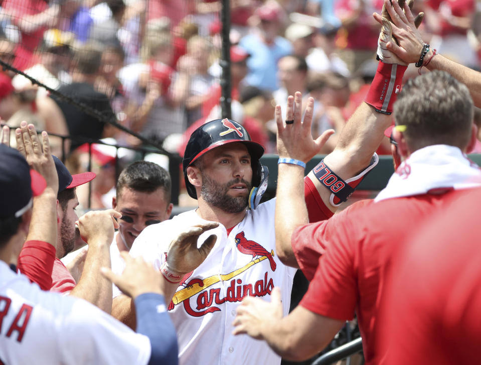 St. Louis Cardinals' Paul Goldschmidt celebrates in the dugout after hitting a solo home run in the first inning of a baseball game against the Detroit Tigers, Sunday, May 7, 2023, in St. Louis. (AP Photo/Tom Gannam)