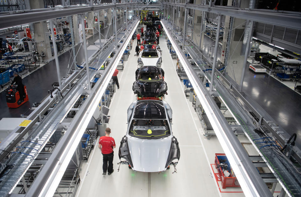 04 March 2020, Baden-Wuerttemberg, Stuttgart: Porsche AG employees assemble a Porsche Taycan in production. Photo: Marijan Murat/dpa (Photo by Marijan Murat/picture alliance via Getty Images)