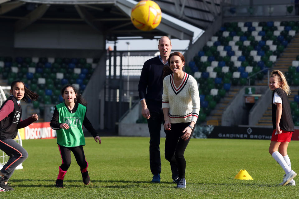 Kate and William go head to head during a football match at Windsor Park stadium in Belfast [Photo: Getty]