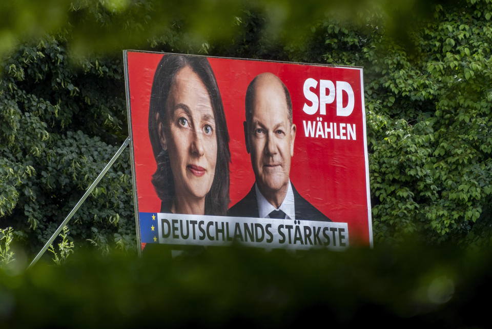 With portraits of German Chancellor Olaf Scholz, right, and top candidate Katarina Barley and the slogans 'Vote SPD' and 'Germany's strongest voice for europe' the Social Democratic Party campaigning for votes in the European election, in Frankfurt, Germany, Thursday, May 30, 2024. The European elections will take place form June 6 to June 9. German politics are in a disgruntled, volatile state as the country's voters prepare to fill 96 of the 720 seats at the European Parliament on June 9, the biggest single national contingent in the 27-nation European Union. It's the first nationwide vote since center-left Chancellor Olaf Scholz took power in late 2021. (AP Photo/Michael Probst)