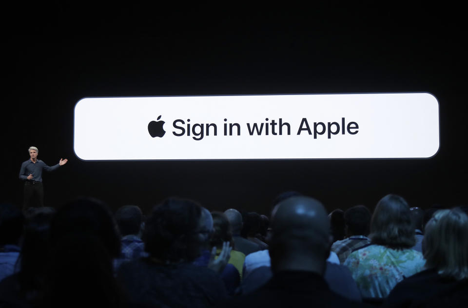 Craig Federighi, Apple's senior vice president of Software Engineering, speaks about the Sign in with Apple feature at the Apple Worldwide Developers Conference in San Jose, Calif., Monday, June 3, 2019. (AP Photo/Jeff Chiu)