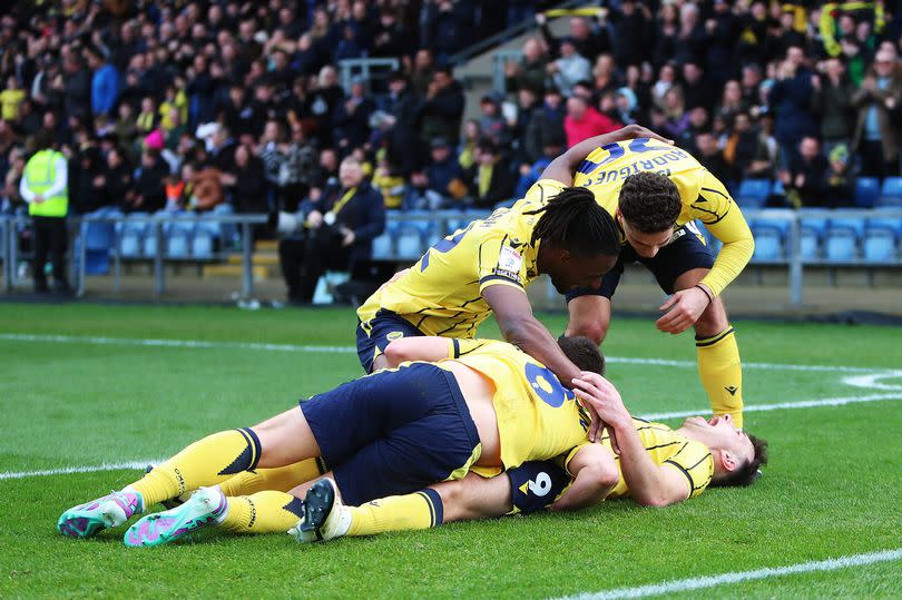 Mark Harris of Oxford United celebrates scoring with team-mates -Credit:Cameron Howard/Getty Images