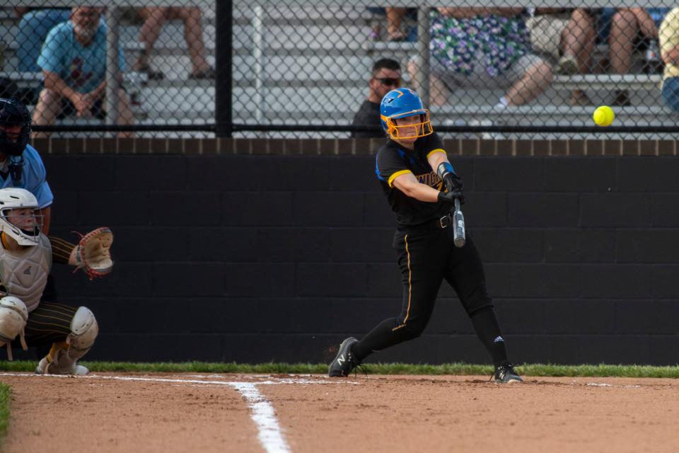 Castle's  Lydia Stowe (23) hits the ball as the Castle Knights play the Central Bears during the 2023 IHSAA 4A softball sectional at North high School Tuesday, May 23, 2023.