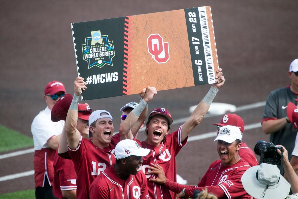 Oklahoma players celebrate after clinching berth in the College World Series. The Sooners beat Virginia Tech in a Super Regional to qualify.