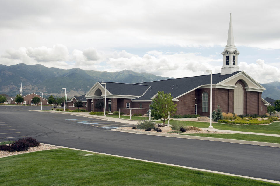 FILE - This Thursday, Aug. 21, 2014, photo shows two LDS chapels built adjacent to each other on Angel Street, in Kaysville, Utah. Amid rising panic about the future of Utah's Great Salt Lake, The Church of Jesus Christ of Latter-day Saints is putting newfound emphasis on environmental stewardship. A high-ranking church official spoke to scientists and politicians at the University of Utah on Friday, March 17, 2023, about the church's recent move to donate 20,000 acre-feet of water to help maintain the elevation of the Great Salt Lake and commitment to re-landscaping its temples and meetinghouses known for their neatly manicured grass. (Rick Egan/The Salt Lake Tribune via AP, File)