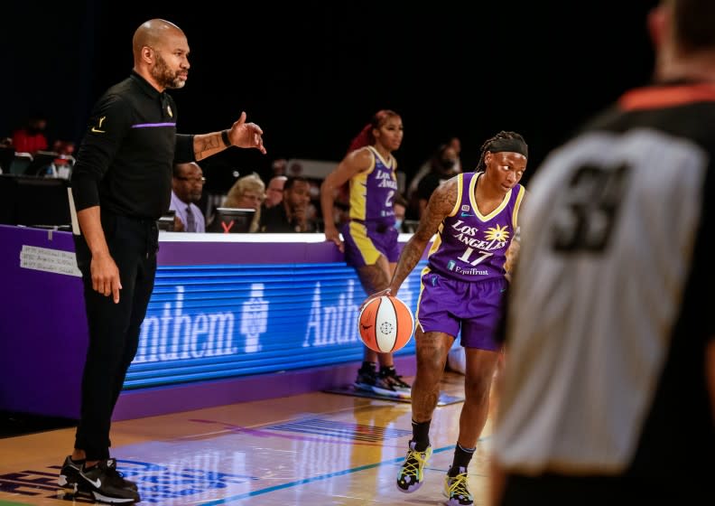 LOS ANGELES, CA. - JUNE 30: Derek Fisher, Head Coach of the Sparks, watches as point guard Erica Wheeler runs the play he drew up against the Las Vegas Aces at the Los Angeles Convention Center on Wednesday, June 30, 2021 in Los Angeles, CA. (Jason Armond / Los Angeles Times)