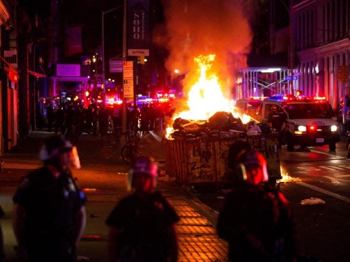 A pile of burning garbage set by demonstrators is seen during looting after marching against the death in Minneapolis police custody of George Floyd, in the Manhattan borough of New York City, U.S., June 1, 2020. REUTERS/Eduardo Munoz