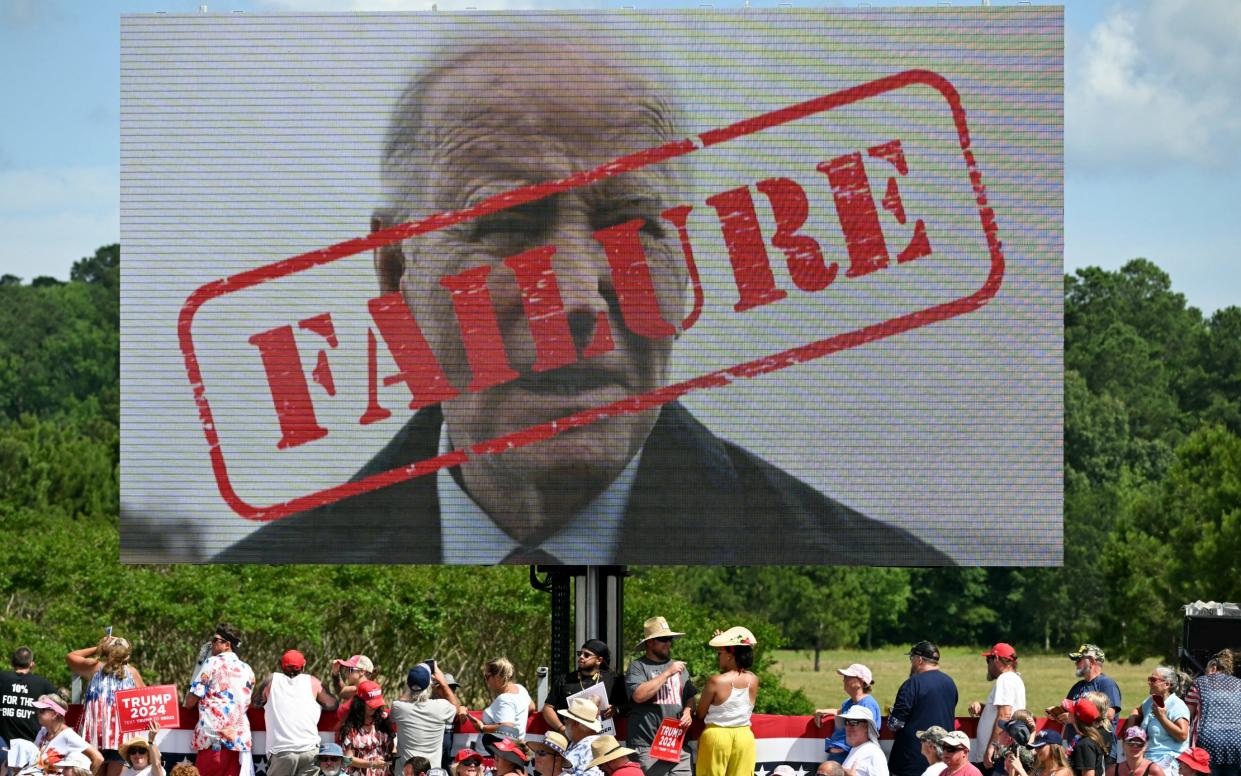 A poster of US President Joe Biden with the word "Failure" stamped across his face