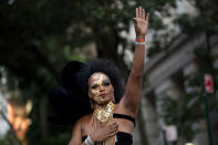 <p>Anthony LaMont waves to the crowd after singing a song during a memorial service and rally for the victims of the 2016 Pulse nightclub shooting, down the street from the historic Stonewall Inn June 12, 2017 in New York City. Monday marks the one year anniversary of the Pulse nightclub shooting in Orlando, Florida that killed 49 people. (Photo: Drew Angerer/Getty Images) </p>