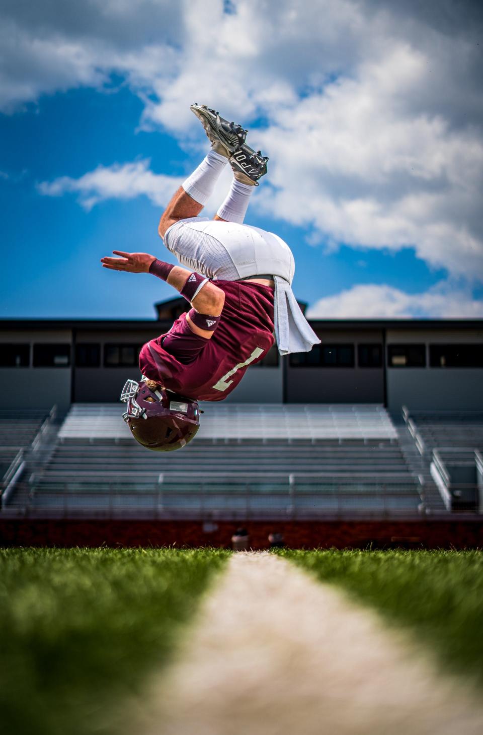 Salina High's Kaiden Comeau performs a backflip.