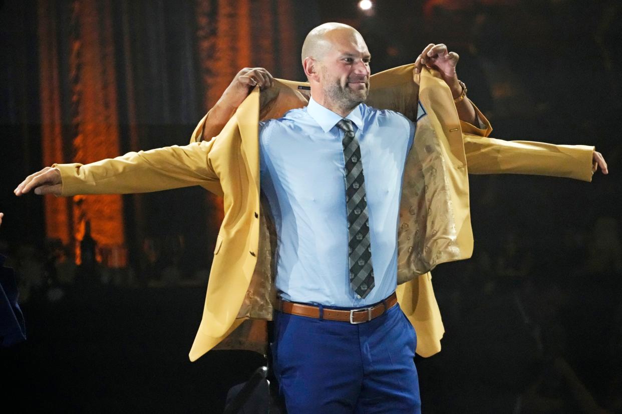 Joe Thomas, a member of the Pro Football Hall of Fame Class of 2023, receives his gold jacket Friday in Canton.