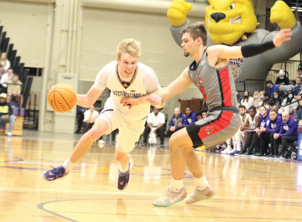 Trenton Massner drives to the basket for Western Illinois.