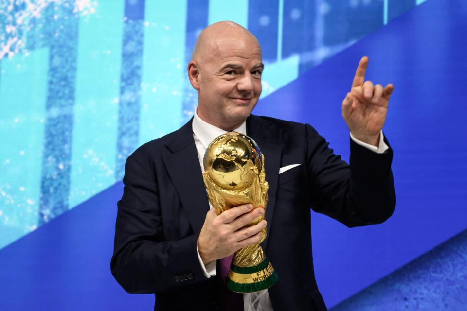 FIFA president Gianni Infantino gestures as he holds the football World Cup trophy during the World Economic Forum (WEF) annual meeting in Davos on May 23, 2022. (Photo by Fabrice COFFRINI / AFP) (Photo by FABRICE COFFRINI/AFP via Getty Images)