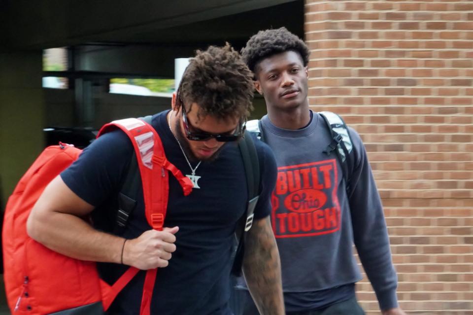 Ohio State football wide receivers Brandon Inniss and Carnell Tate check into the team's hotel for fall camp in Grandview, Ohio, on Aug. 7, 2023.