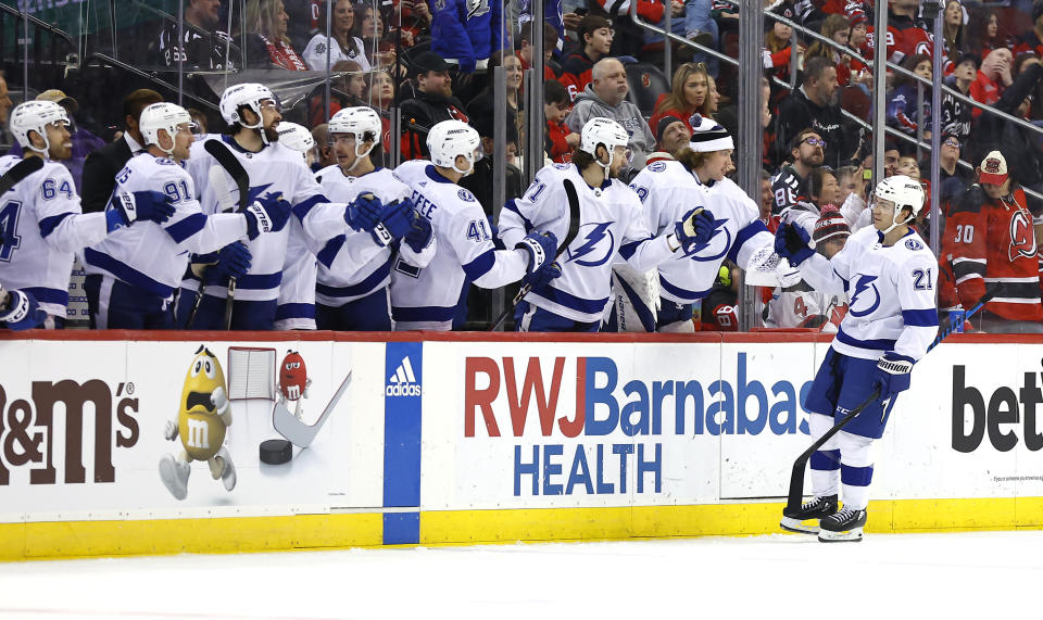Tampa Bay Lightning center Brayden Point (21) celebrates with teammates after scoring a goal against the New Jersey Devils during the second period of an NHL hockey game, Sunday, Feb. 25, 2024, in Newark, N.J. (AP Photo/Noah K. Murray)