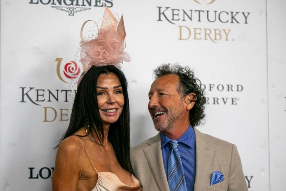 Rob Angel and Susan Booth of Pictionary walk the red carpet at Churchill Downs in Louisville, Ky., Saturday, May 7, 2022.