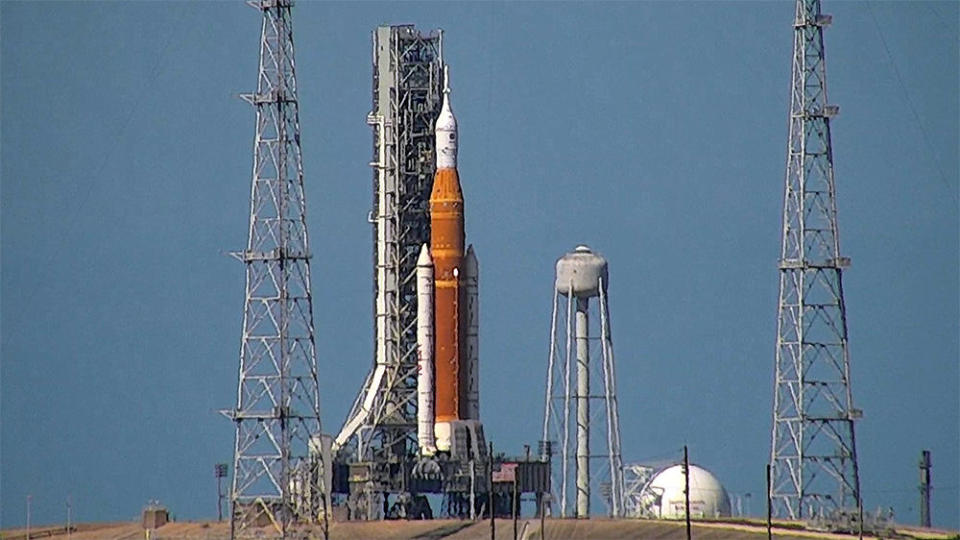 The Space Launch System moon rocket, seen Tuesday atop pad 39B at the Kennedy Space Center. After two earlier attempts to complete a dress rehearsal countdown and fueling test, NASA began a third practice countdown Tuesday. / Credit: CBS News