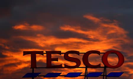 FILE PHOTO: A company logo is pictured outside a Tesco supermarket in Altrincham northern England, April 16, 2016. REUTERS/Phil Noble/File Photo