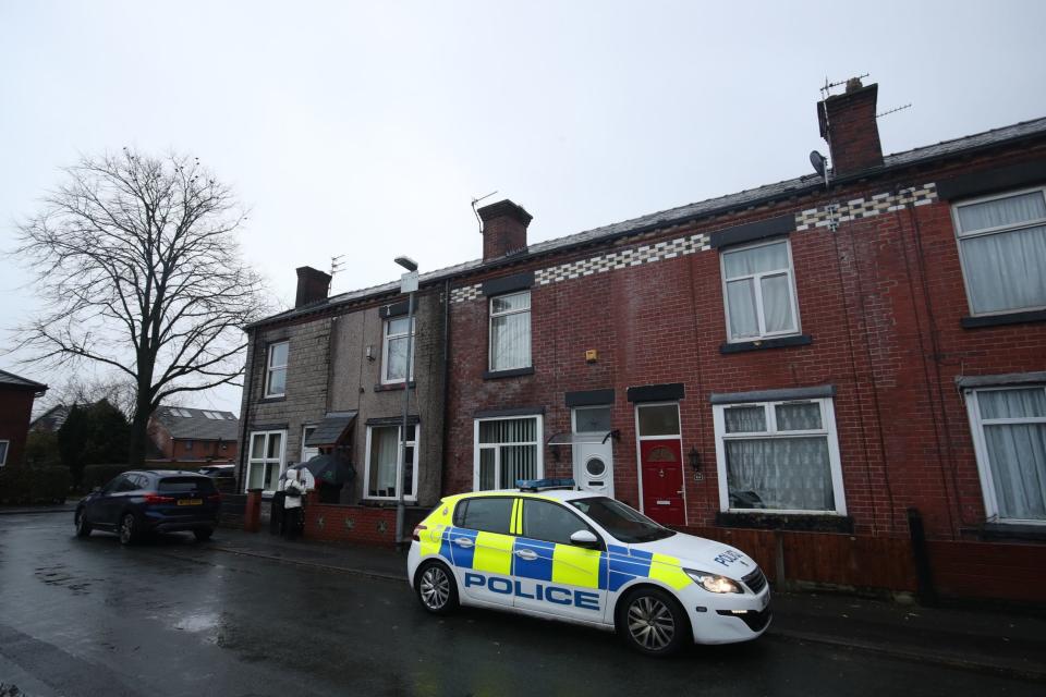 Police outside the house in Arthur Street, Little Lever, Bolton, where they are investigating the death of a woman and two young children (Danny Lawson/PA Wire)